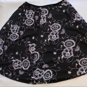Women’s black skirt with sequin flower design